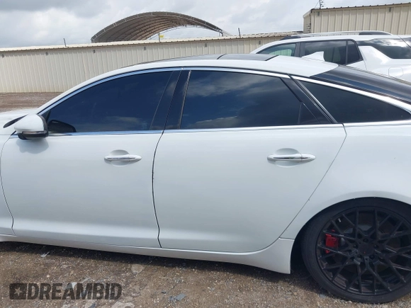 2014 Jaguar XJ R with VIN SAJWA1EK3EMV58692, listed as a IAAI auction lot 42663979 with 111,386 mi miles and . Bid and sale history available at DreamBid. Image 14.