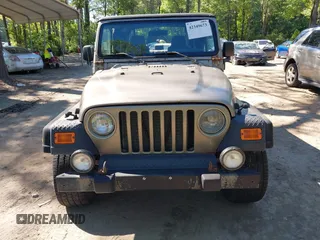 2003 Jeep Wrangler Sport z VIN 1J4FA49S13P313180, wystawiony jako IAAI lot #42349673 z przebiegiem 141 073 mil mil oraz . Historia ofert i sprzedaży dostępna na DreamBid. Obrazek 12.