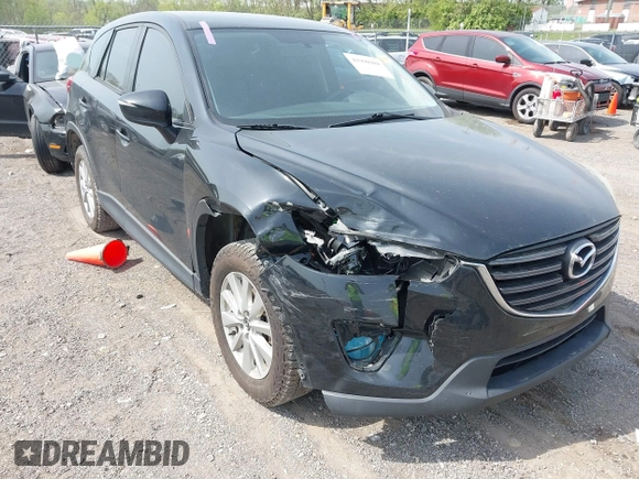 2016 Mazda CX-5 Sport with VIN JM3KE4BY8G0746377, listed as a IAAI auction lot 41990988 with 144,558 mi miles and . Bid and sale history available at carsss.com. Image 6.