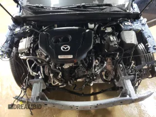 2024 Mazda CX-50 Premium z VIN 7MMVABDY0RN174004, wystawiony jako Copart lot #44727115 z przebiegiem 4 796 mil mil oraz Szkoda całkowita • Salvage title. Historia ofert i sprzedaży dostępna na DreamBid. Obrazek 11.