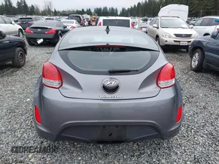 2012 Hyundai Veloster w/Gray Int z VIN KMHTC6AD7CU037130, wystawiony jako IAAI lot #41778588 z przebiegiem 125 549 mil mil oraz . Historia ofert i sprzedaży dostępna na DreamBid. Obrazek 16.