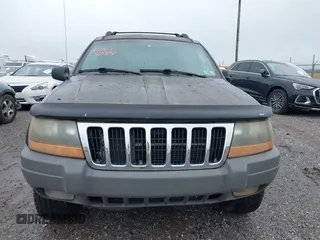 2002 Jeep Grand Cherokee with VIN 1J4GW38N62C190851, listed as a IAAI auction lot 42519384 with 142,066 mi miles and . Bid and sale history available at DreamBid. Image 6.
