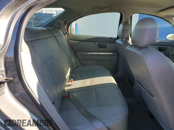 2005 Ford Taurus z VIN 1FAHP59U15A158162, wystawiony jako Copart lot #81109994 z przebiegiem 81 196 mil mil oraz Czysty tytuł • Clean title. Historia ofert i sprzedaży dostępna na DreamBid. Obrazek 10.