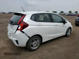 2016 Honda Fit LX with VIN JHMGK5H59GX004764, listed as a Copart auction lot 65131715 with 75,726 mi miles and Salvage title. Bid and sale history available at DreamBid. Image 3.