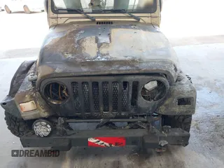 2003 Jeep Wrangler Sahara z VIN 1J4FA59S63P336928, wystawiony jako IAAI lot #42254314 z przebiegiem Nie podano mil oraz . Historia ofert i sprzedaży dostępna na DreamBid. Obrazek 6.