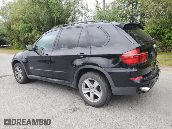 2012 BMW X5 35d with VIN 5UXZW0C54CL671377, listed as a Copart auction lot 60936395 with 105,903 mi miles and Salvage title. Bid and sale history available at DreamBid. Image 2.