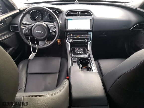 2019 Jaguar XE 25t with VIN SAJAR4FX6KCP52410, listed as a Copart auction lot 82199484 with 89,027 mi miles and Salvage Title. Bid and sale history available at carsss.com. Image 8.