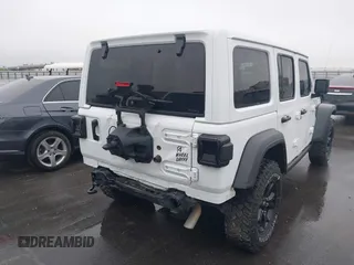 2023 Jeep Wrangler Sport with VIN 1C4HJXDN8PW523532, listed as a IAAI auction lot 41962483 with 14,643 mi miles and . Bid and sale history available at DreamBid. Image 4.