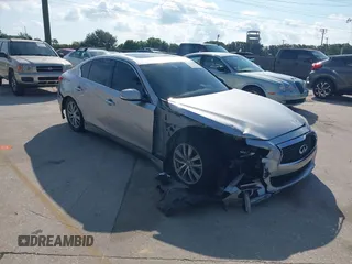 2014 Infiniti Q50 with VIN JN1BV7AP4EM677506, listed as a IAAI auction lot 40113207 with 142,446 mi miles. Bid and sale history available at carsss.com. Image 1.