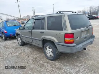 1995 Jeep Grand Cherokee Laredo with VIN 1J4GZ58S4SC555309, listed as a IAAI auction lot 41600141 with 130,493 mi miles. Bid and sale history available at carsss.com. Image 3.