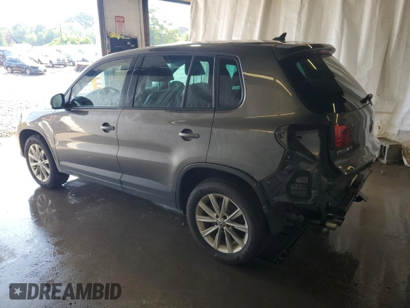 2014 Volkswagen Tiguan SEL with VIN WVGBV3AX2EW541476, listed as a Copart auction lot 64817795 with 158,032 mi miles and Salvage title. Bid and sale history available at DreamBid. Image 2.