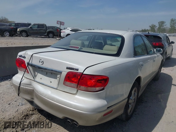 2001 Mazda Millenia with VIN JM1TA221011711379, listed as a IAAI auction lot 41897580 with 151,307 mi miles and . Bid and sale history available at DreamBid. Image 4.
