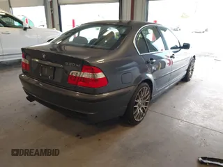 2003 BMW 3 Series 330xi with VIN WBAEW53463PG22999, listed as a IAAI auction lot 41596907 with 160,812 mi miles. Bid and sale history available at carsss.com. Image 4.
