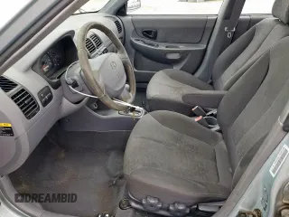 2003 Hyundai Accent GL z VIN KMHCG45C73U481294, wystawiony jako Copart lot #55958005 z przebiegiem 136 964 mil mil oraz Czysty tytuł • Clean title. Historia ofert i sprzedaży dostępna na DreamBid. Obrazek 7.