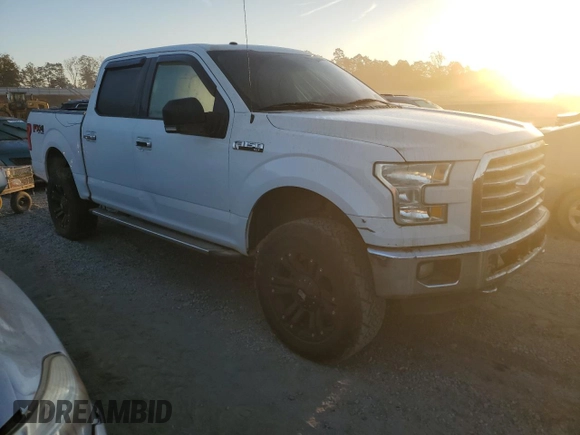 2015 Ford F-150 XLT with VIN 1FTEW1EFXFFB04685, listed as a Copart auction lot 77041514 with 161,088 mi miles and Salvage Title. Bid and sale history available at carsss.com. Image 4.