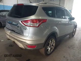 2015 Ford Escape Titanium z VIN 1FMCU9J96FUB23902, wystawiony jako IAAI lot #42497188 z przebiegiem 164 452 mil mil oraz . Historia ofert i sprzedaży dostępna na DreamBid. Obrazek 4.