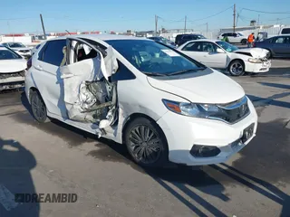 2019 Honda Fit Sport z VIN 3HGGK5H60KM717921, wystawiony jako IAAI lot #41831556 z przebiegiem 57 061 mil mil oraz . Historia ofert i sprzedaży dostępna na DreamBid. Obrazek 1.