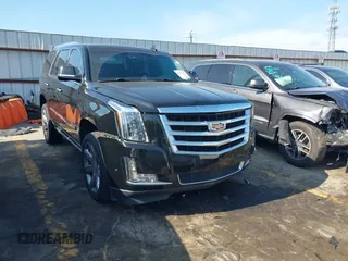 2017 Cadillac Escalade Premium Luxury z VIN 1GYS3CKJ2HR121993, wystawiony jako IAAI lot #42172777 z przebiegiem 157 494 mil mil oraz . Historia ofert i sprzedaży dostępna na DreamBid. Obrazek 1.