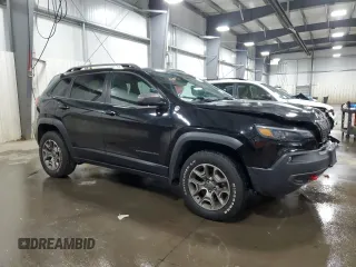2020 Jeep Cherokee Trailhawk with VIN 1C4PJMBX2LD638678, listed as a Copart auction lot 52197785 with 103,724 mi miles and Salvage title. Bid and sale history available at DreamBid. Image 4.