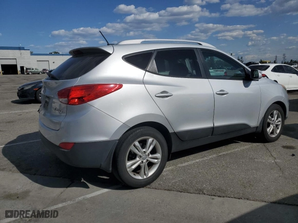 2013 Hyundai Tucson GLS with VIN KM8JU3AC4DU737909, listed as a Copart auction lot 52050955 with 130,707 mi miles and Salvage Title. Bid and sale history available at carsss.com. Image 3.