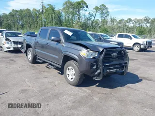 2018 Toyota Tacoma SR with VIN 5TFAX5GN1JX120428, listed as a IAAI auction lot 42611841 with 100,023 mi miles and . Bid and sale history available at DreamBid. Image 1.