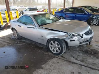 1999 Mercedes-Benz SLK-Class with VIN WDBKK47F0XF133643, listed as a IAAI auction lot 41378214 with 209,283 mi miles. Bid and sale history available at carsss.com. Image 1.
