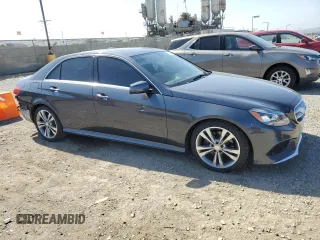 2015 Mercedes-Benz E 350 Sport with VIN WDDHF5KB9FB088305, listed as a Copart auction lot 54849945 with 124,315 mi miles and Salvage title. Bid and sale history available at DreamBid. Image 4.