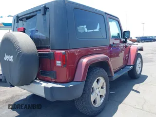2010 Jeep Wrangler Sahara z VIN 1J4AA5D14AL125062, wystawiony jako IAAI lot #42418736 z przebiegiem 90 839 mil mil oraz . Historia ofert i sprzedaży dostępna na DreamBid. Obrazek 4.