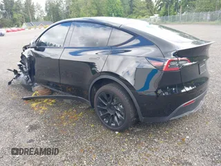 2023 Tesla Model Y Long Range z VIN 7SAYGDEE2PF885116, wystawiony jako IAAI lot #40091902 z przebiegiem 11 779 mil mil oraz . Historia ofert i sprzedaży dostępna na DreamBid. Obrazek 3.