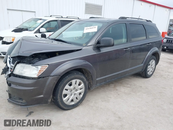 2017 Dodge Journey SE with VIN 3C4PDCABXHT694909, listed as a IAAI auction lot 41640828 with 188,657 mi miles and . Bid and sale history available at DreamBid. Image 17.