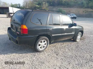 2006 GMC Envoy SLE with VIN 1GKDT13S262204960, listed as a IAAI auction lot 42045236 with 183,338 mi miles. Bid and sale history available at carsss.com. Image 4.