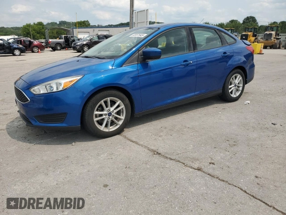 2018 Ford Focus SE with VIN 1FADP3F23JL214428, listed as a Copart auction lot 60552465 with 33,699 mi miles and Salvage title. Bid and sale history available at DreamBid. Image 2.