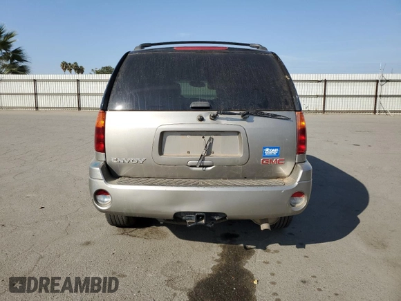 2003 GMC Envoy SLE with VIN 1GKDS13S332390989, listed as a Copart auction lot 74729104 with 127,680 mi miles and Salvage Title. Bid and sale history available at DreamBid. Image 6.