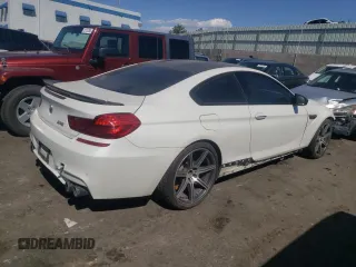 2016 BMW M6 z VIN WBS6J9C56GD934498, wystawiony jako Copart lot #73539754 z przebiegiem 116 944 mil mil oraz Czysty tytuł • Clean title. Historia ofert i sprzedaży dostępna na DreamBid. Obrazek 3.