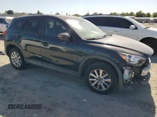 2016 Mazda CX-5 Touring z VIN JM3KE2CY5G0617516, wystawiony jako Copart lot #56421005 z przebiegiem 110 739 mil mil oraz Szkoda całkowita • Salvage title. Historia ofert i sprzedaży dostępna na DreamBid. Obrazek 4.