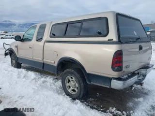 1998 Ford F-150 Standard with VIN 1FTZX18W5WKB97701, listed as a IAAI auction lot 41254873 with 291,523 mi miles. Bid and sale history available at carsss.com. Image 3.