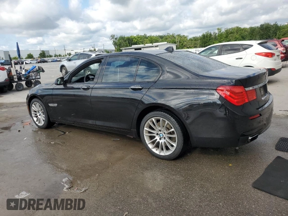 2011 BMW 7 Series 740i with VIN WBAKA4C52BC612977, listed as a Copart auction lot 52582575 with 157,813 mi miles and Salvage Title. Bid and sale history available at carsss.com. Image 2.