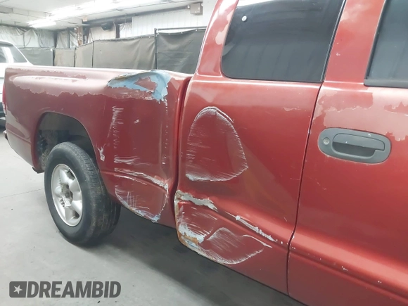 1999 Dodge Dakota SLT z VIN 1B7GL22XXXS240005, wystawiony jako IAAI lot #42269211 z przebiegiem 218 163 mil mil oraz . Historia ofert i sprzedaży dostępna na DreamBid. Obrazek 6.