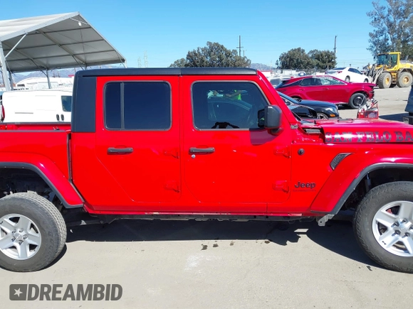 2022 Jeep Gladiator Willys Sport z VIN 1C6HJTAG0NL180848, wystawiony jako IAAI lot #41778129 z przebiegiem Nie podano mil oraz . Historia ofert i sprzedaży dostępna na DreamBid. Obrazek 14.