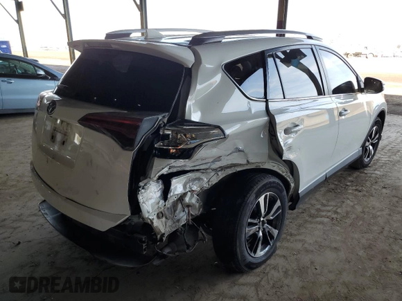2018 Toyota RAV4 XLE with VIN JTMWFREV2JJ740145, listed as a Copart auction lot 52214075 with 129,940 mi miles and Salvage title. Bid and sale history available at DreamBid. Image 3.
