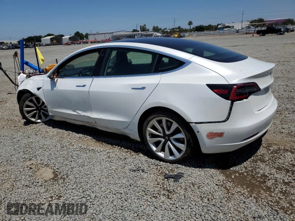 2019 Tesla Model 3 Mid Range z VIN 5YJ3E1EA3KF402556, wystawiony jako Copart lot #56212875 z przebiegiem 89 022 mil mil oraz Szkoda całkowita • Salvage title. Historia ofert i sprzedaży dostępna na DreamBid. Obrazek 2.
