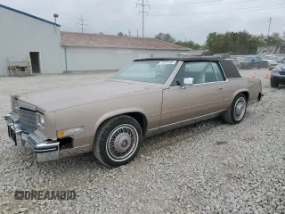 1985 Cadillac Eldorado z VIN 1G6EL5788FE655155, wystawiony jako Copart lot #73223134 z przebiegiem 68 676 mil mil oraz Tytuł czysty. Historia ofert i sprzedaży dostępna na DreamBid. Obrazek 1.