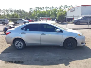 2018 Toyota Corolla L with VIN 5YFBURHEXJP810003, listed as a IAAI auction lot 42526648 with 84,546 mi miles and . Bid and sale history available at DreamBid. Image 14.