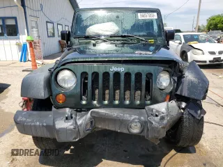 2010 Jeep Wrangler Rubicon with VIN 1J4BA6D12AL221220, listed as a Copart auction lot 56057055 with 200,346 mi miles and Salvage title. Bid and sale history available at DreamBid. Image 5.
