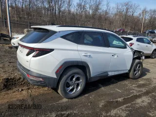 2022 Hyundai Tucson SEL with VIN 5NMJBCAE0NH027913, listed as a Copart auction lot 47072315 with 56,881 mi miles and Salvage Title. Bid and sale history available at carsss.com. Image 3.
