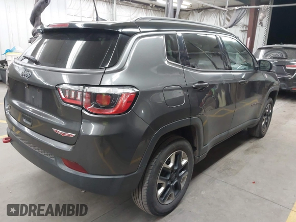 2018 Jeep Compass Trailhawk with VIN 3C4NJDDB5JT451600, listed as a IAAI auction lot 41893541 with 155,528 mi miles and . Bid and sale history available at DreamBid. Image 4.