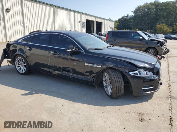 2015 Jaguar XJ with VIN SAJWA1CZ7F8V83167, listed as a Copart auction lot 74991144 with 94,502 mi miles and Salvage Title. Bid and sale history available at carsss.com. Image 4.