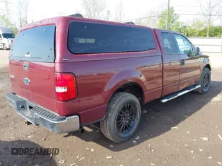 2005 Ford F-150 XLT with VIN 1FTPX12505FB69853, listed as a IAAI auction lot 42092756 with 330,699 mi miles. Bid and sale history available at carsss.com. Image 4.