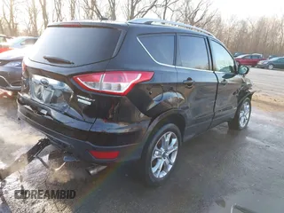 2014 Ford Escape Titanium with VIN 1FMCU0JX0EUC21512, listed as a IAAI auction lot 41781026 with 142,771 mi miles. Bid and sale history available at carsss.com. Image 4.