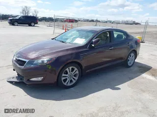 2011 Kia Optima EX with VIN KNAGN4A7XB5055304, listed as a IAAI auction lot 42023759 with 158,385 mi miles. Bid and sale history available at carsss.com. Image 2.